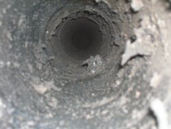 Is it normal to hear some small pieces of creosote dropping in the stovepipe / top of insert?