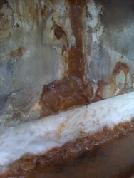 1-Rusty water flowing down from seeping weld at top on underside of furnace door-s.jpg