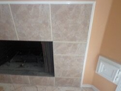 Can I cover the black "frame" around the fireplace?