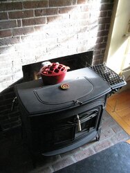 some smoke from cat stove on rainy/mild day - is this OK?