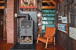 living-and-dining-area-with-fire-stove-and-vintage-furniture.jpg