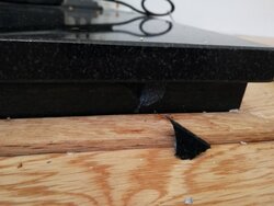 Granite hearth damaged by lack of floorboard expansion gap