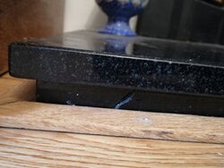 Granite hearth damaged by lack of floorboard expansion gap