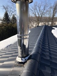 Chimney dripping brown stuff on new metal roof - concerned of damage and root cause