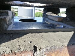 Suggestions needed to feed a rigid tube liner above the roof with a flat concrete top.