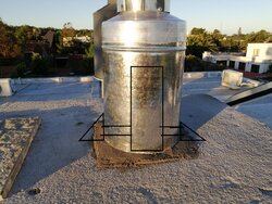 Suggestions needed to feed a rigid tube liner above the roof with a flat concrete top.