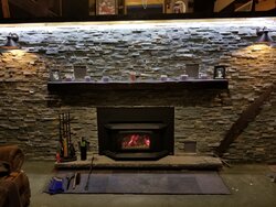 Stacked stone over painted fireplace