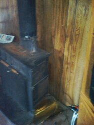 Ok class can you tell me what is wrong with this wood stove and the wall?  Sorry about the blurry pi