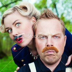 istockphoto_12978801-man-and-woman-wearing-fake-mustaches.jpg