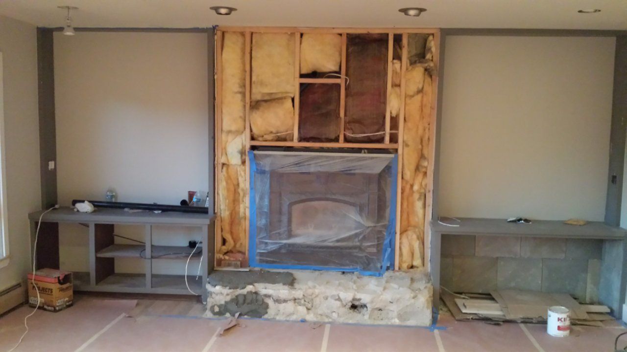 Fireplace with insulation behind the framing