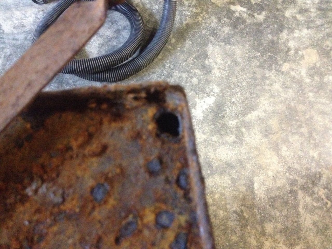 Hole in top where metal is rusted through