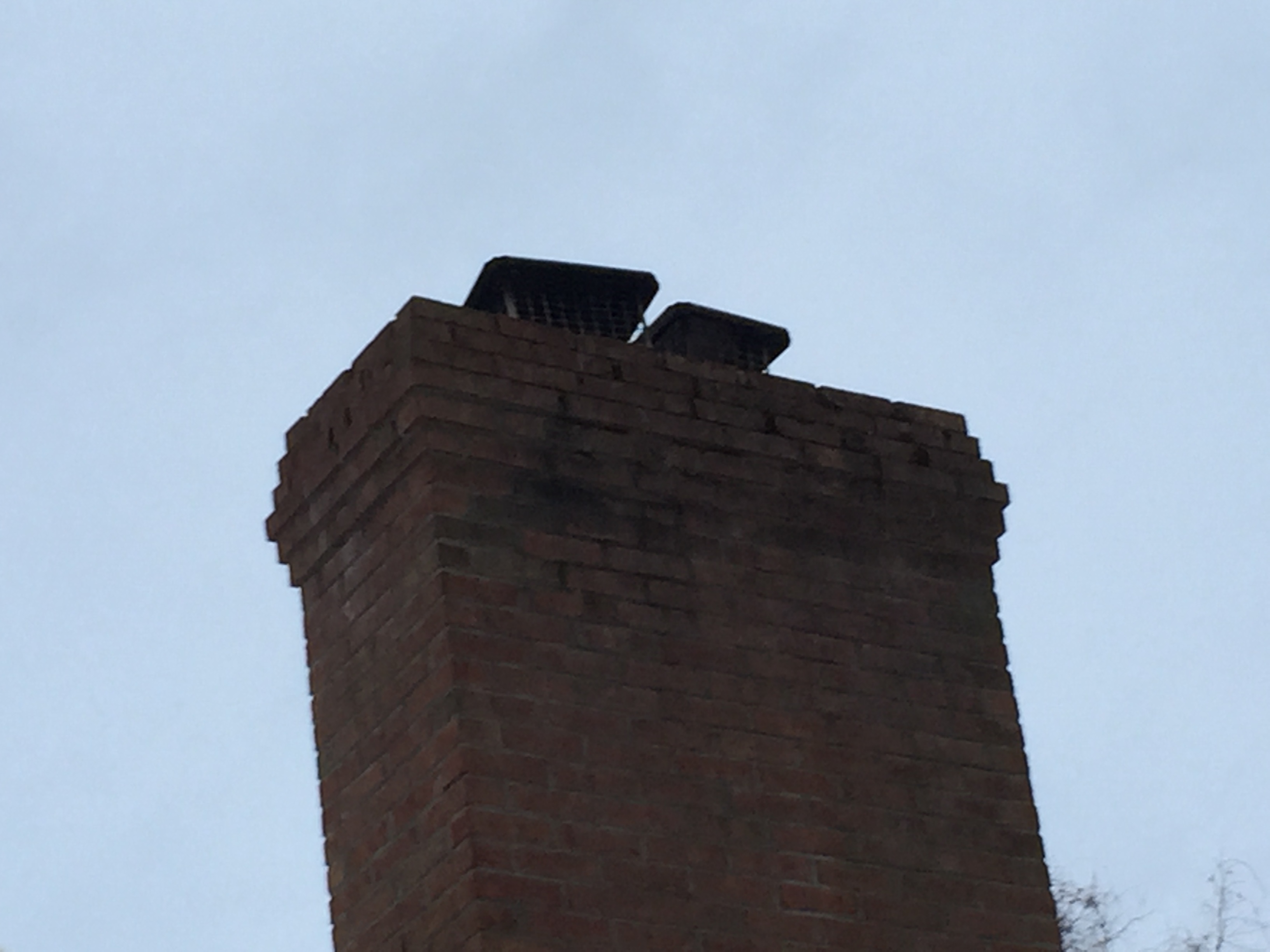 Need help identifying these vertical bricks on my chimney