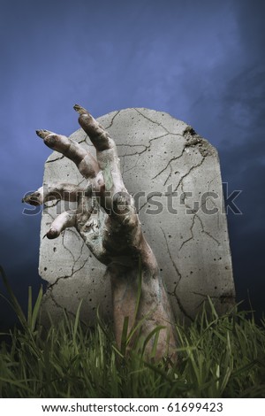 stock-photo-zombie-hand-coming-out-of-his-grave-61699423.jpg
