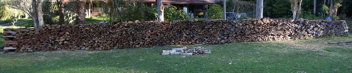 20131021%20firewood%20stacked%20row%201%20along%20fence%20LQ.jpg