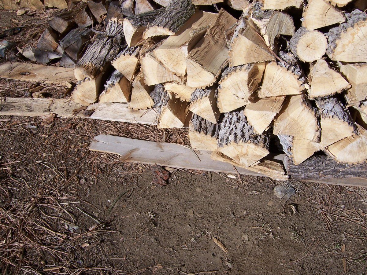Crushed stone or raised floor for wood shed