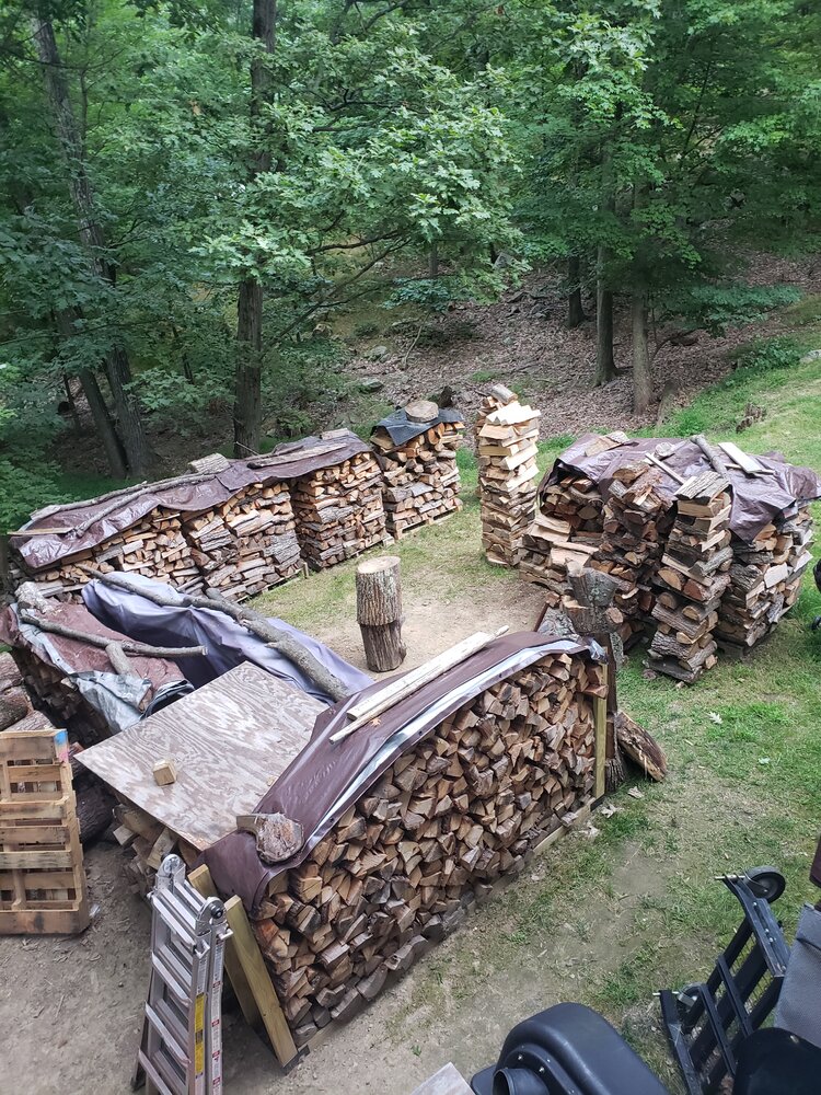 Stacks from the summer....I think i need something a bit better than the tarps and pallets.