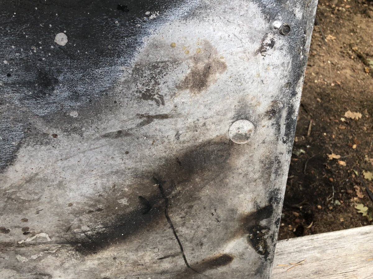 I have a Temco prefab fireplace with a hole in the refractory panel. The  previous owners burned wood, but maybe they wanted to convert it to gas?  Not sure why the hole