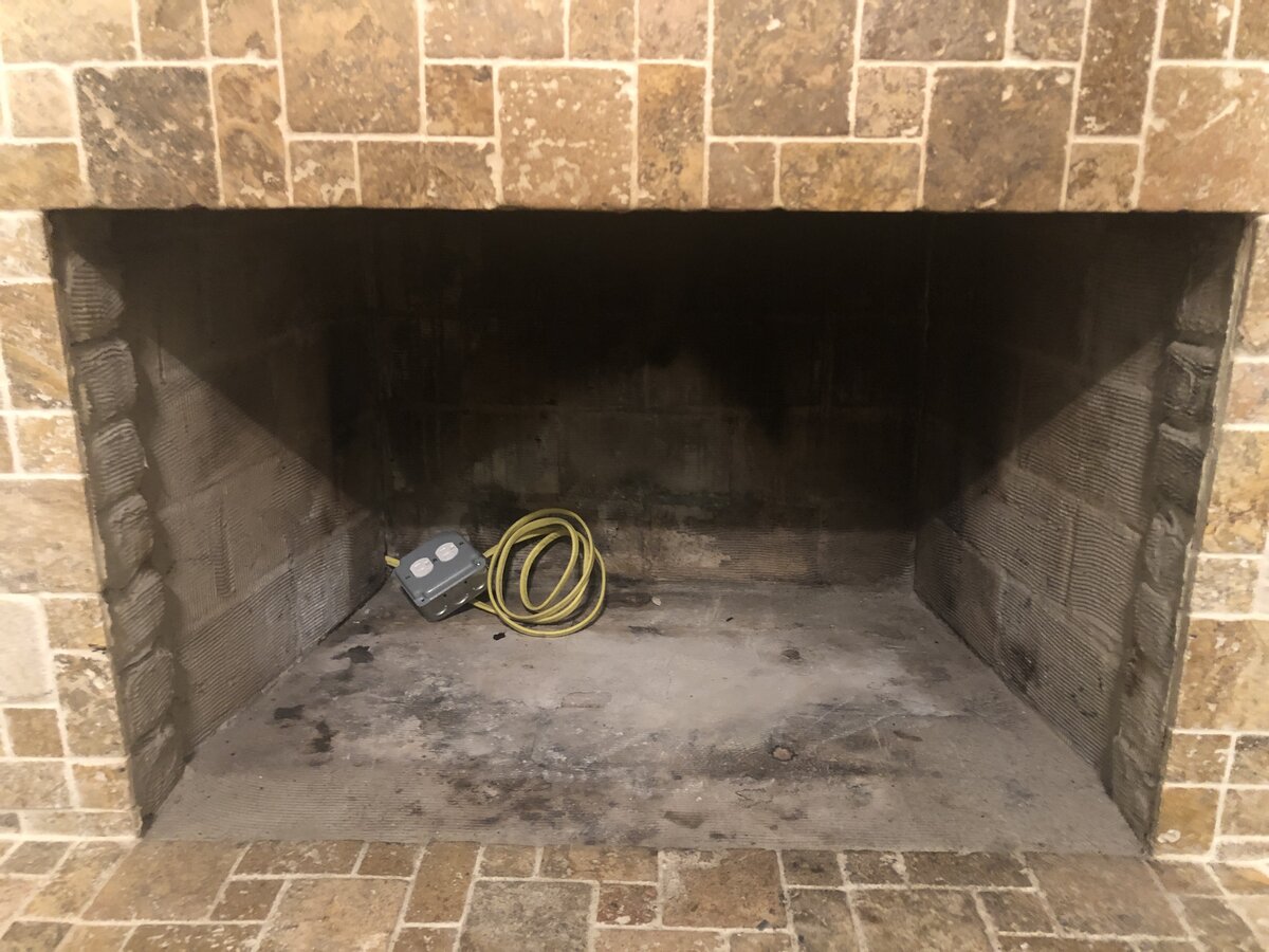 Install Electric Outlet Behind Fireplace?