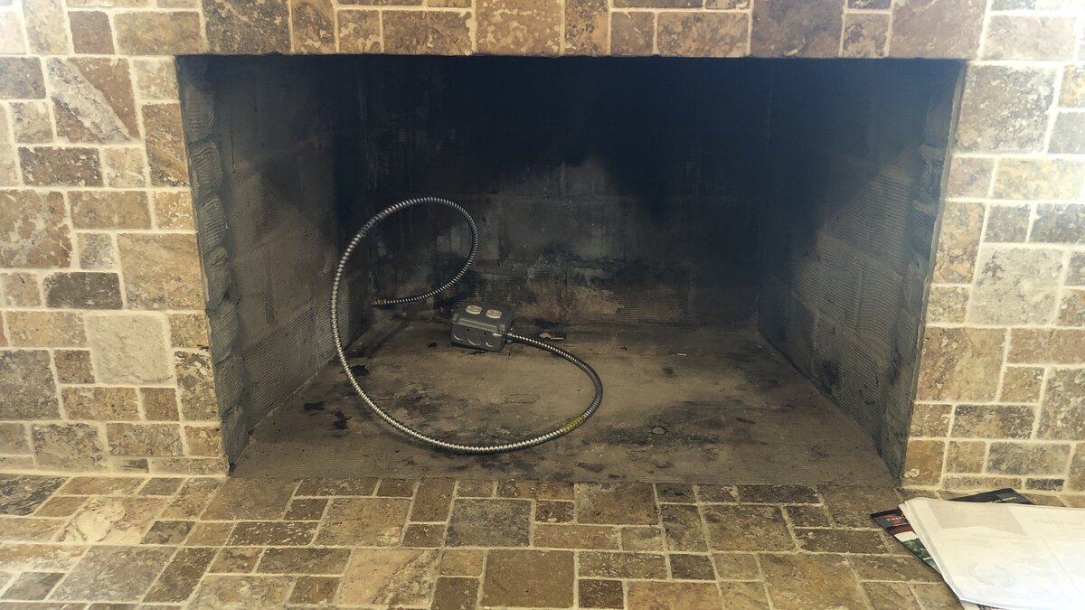 Install Electric Outlet Behind Fireplace?