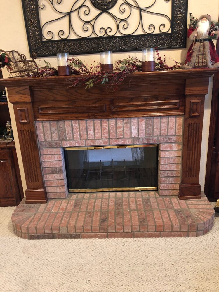 I have a Temco prefab fireplace with a hole in the refractory panel. The  previous owners burned wood, but maybe they wanted to convert it to gas?  Not sure why the hole