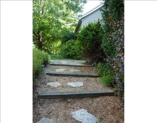 Landscaping a walkway: grassy to stones