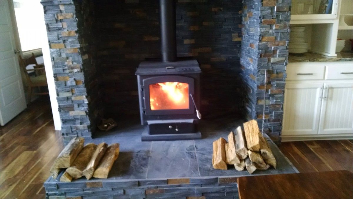 Wood stove inside fireplace?