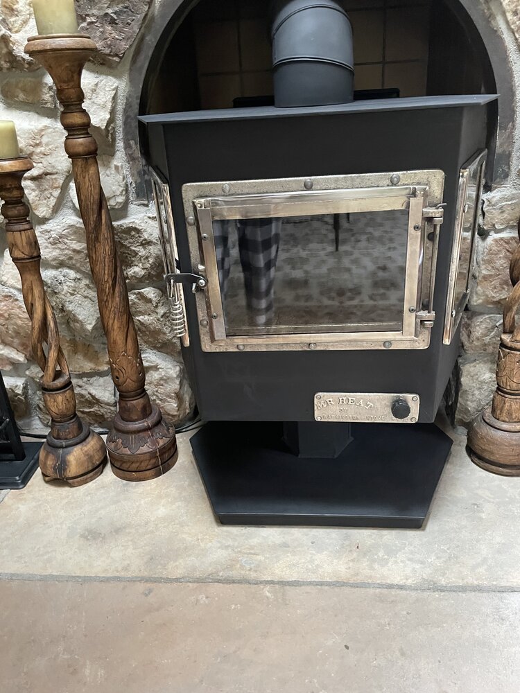 Can anyone tell me about this Mr Heat wood stove by Washington Stove works?  It has a blower on the back that may be original or not.