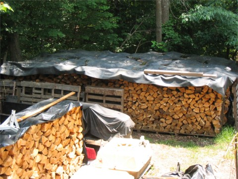 No woodshed this year-can I tarp my stacks in place when snow comes?