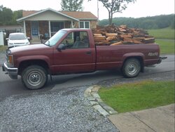 New Wood hauler, truck bed full of Wood,  broken window!