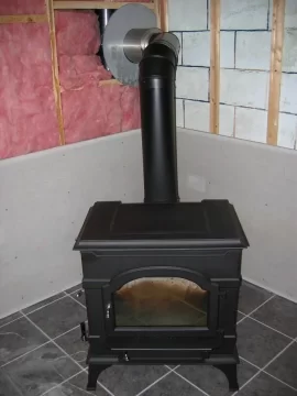 [Hearth.com] Can the chimney go through a wall at an angle?
