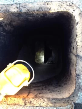 [Hearth.com] Install a liner in a chimney with brick and mortar  in the way