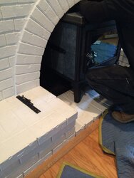 Painted brick outside fireplace a problem?