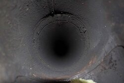 Pipe in Thimble Sloping Downward - Can I fix this myself?