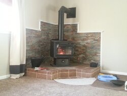 Need ideas for hearth and wall behind stoves.