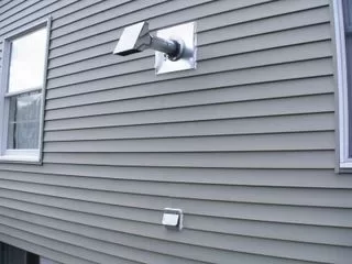[Hearth.com] It's really windy here and getting a smokey smell inside the house...Is this normal?