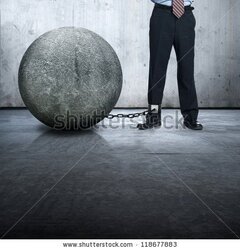 stock-photo-businessman-lock-with-stone-ball-118677883.jpg