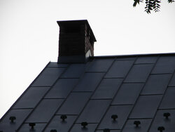 What are your opinions about a chimney near roof's ridgeline