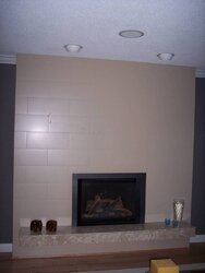 Hairline cracks in new gas insert fireplace Tile surround, possible causes please
