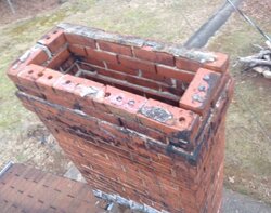 1949, one brick thick, wobbly chimney