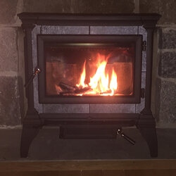 Wood stove in front of existing fireplace?
