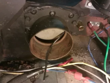 [Hearth.com] Fire behind the burn pot of a Harman Accentra FS...
