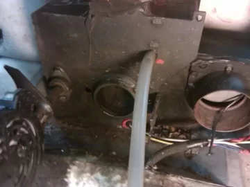 [Hearth.com] Fire behind the burn pot of a Harman Accentra FS...
