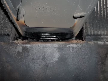 [Hearth.com] Fire behind the burn pot of a Harman Accentra FS...