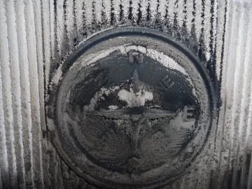 [Hearth.com] Fire behind the burn pot of a Harman Accentra FS...
