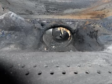 [Hearth.com] Fire behind the burn pot of a Harman Accentra FS...
