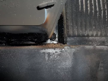 [Hearth.com] Fire behind the burn pot of a Harman Accentra FS...