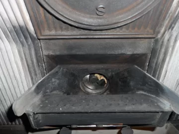 [Hearth.com] Fire behind the burn pot of a Harman Accentra FS...