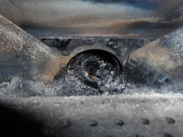 [Hearth.com] Fire behind the burn pot of a Harman Accentra FS...