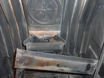 [Hearth.com] Fire behind the burn pot of a Harman Accentra FS...