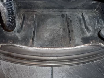 [Hearth.com] Fire behind the burn pot of a Harman Accentra FS...